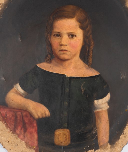 Oil painting of a child with ringlet curls. The subject, situated in a dark, opaque background, leans against a red drapery. The figure wears a green button-down shirt with white short sleeves. A yellow square buckle with the image of a laurel is at the bottom, center of the shirt.