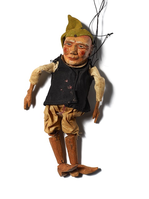 Photo of a wooden marionette dressed as a dwarf from the fairy tale, Snow White and the Dwarfs.