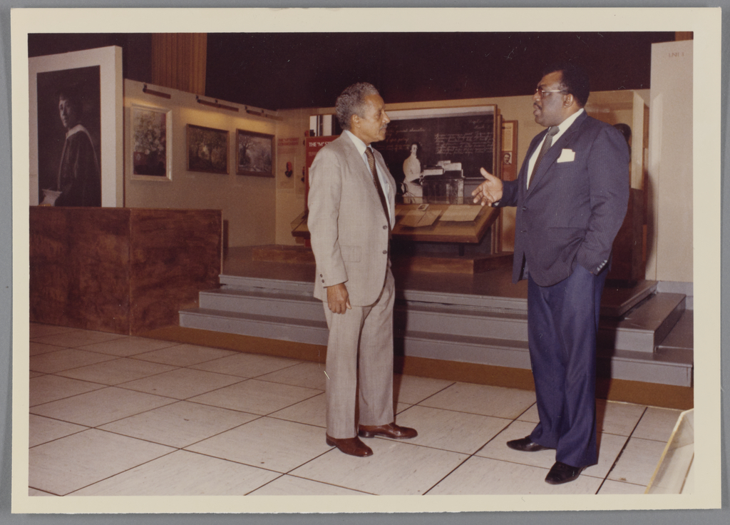 Two people look at a museum exhibit