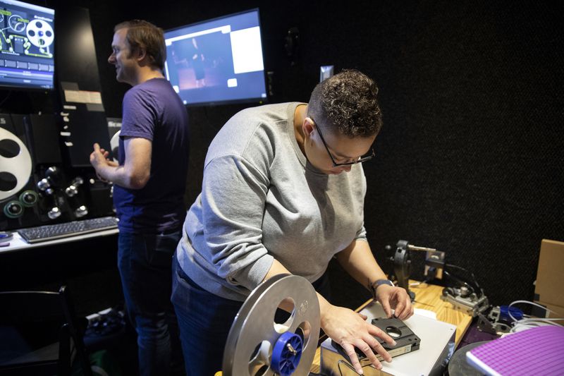 Image of workers inside mobile media conservation lab