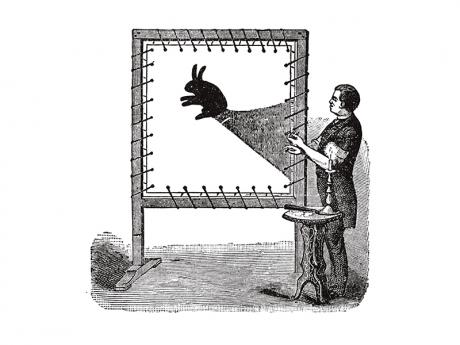 Icon of magician performing shadow puppet