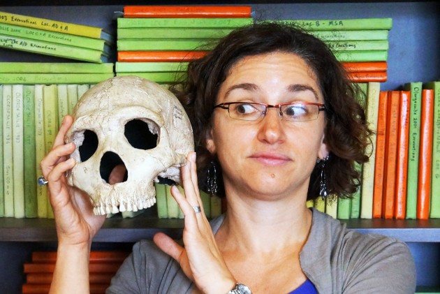 Briana Pobiner holding a skull.