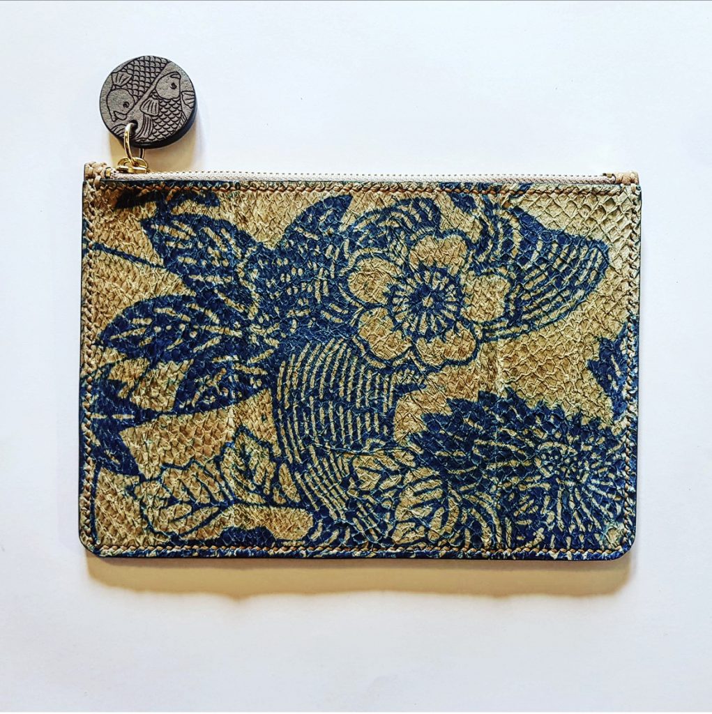 Tan rectangular bag with blue floral pattern