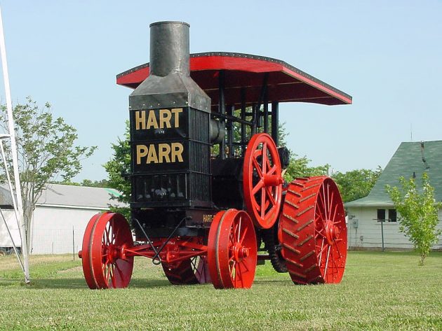 black tractor with red wheels