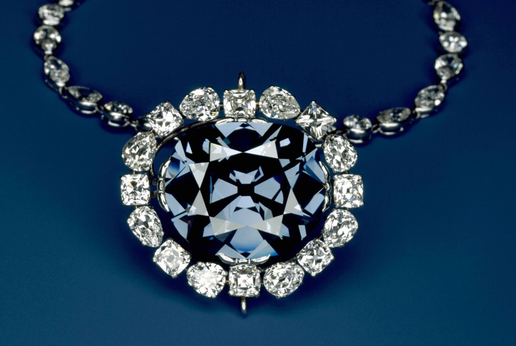 The 45.52 carat, deep-blue Hope Diamond is shown here inside its surrounding pendant of 16 pear- and cushion-cut white diamonds. (Photo by Chip Clark)