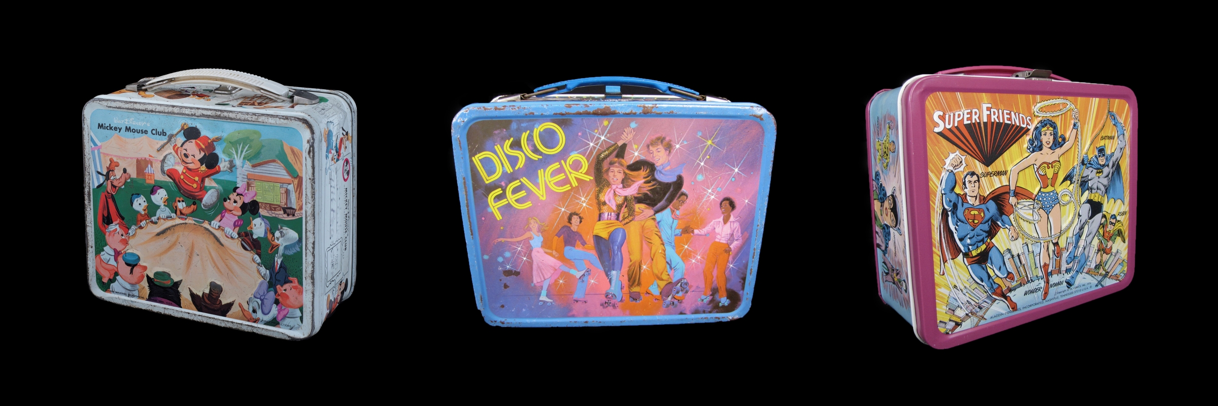 Three metal lunch boxes with designs for the Mickey Mouse Club, disco dancers, and Super Friends heroes