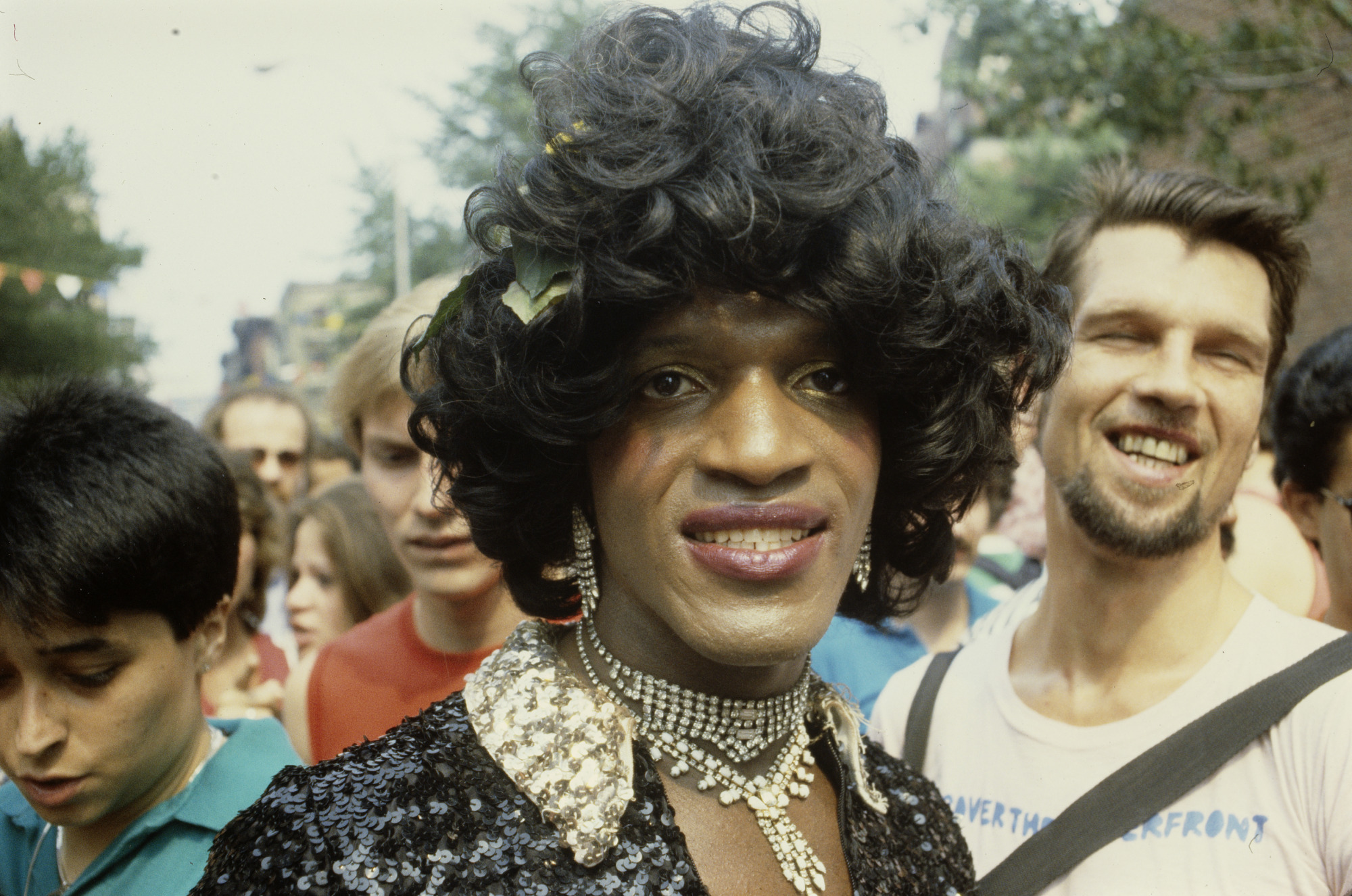 Marsha Johnson with a group of people behind her.