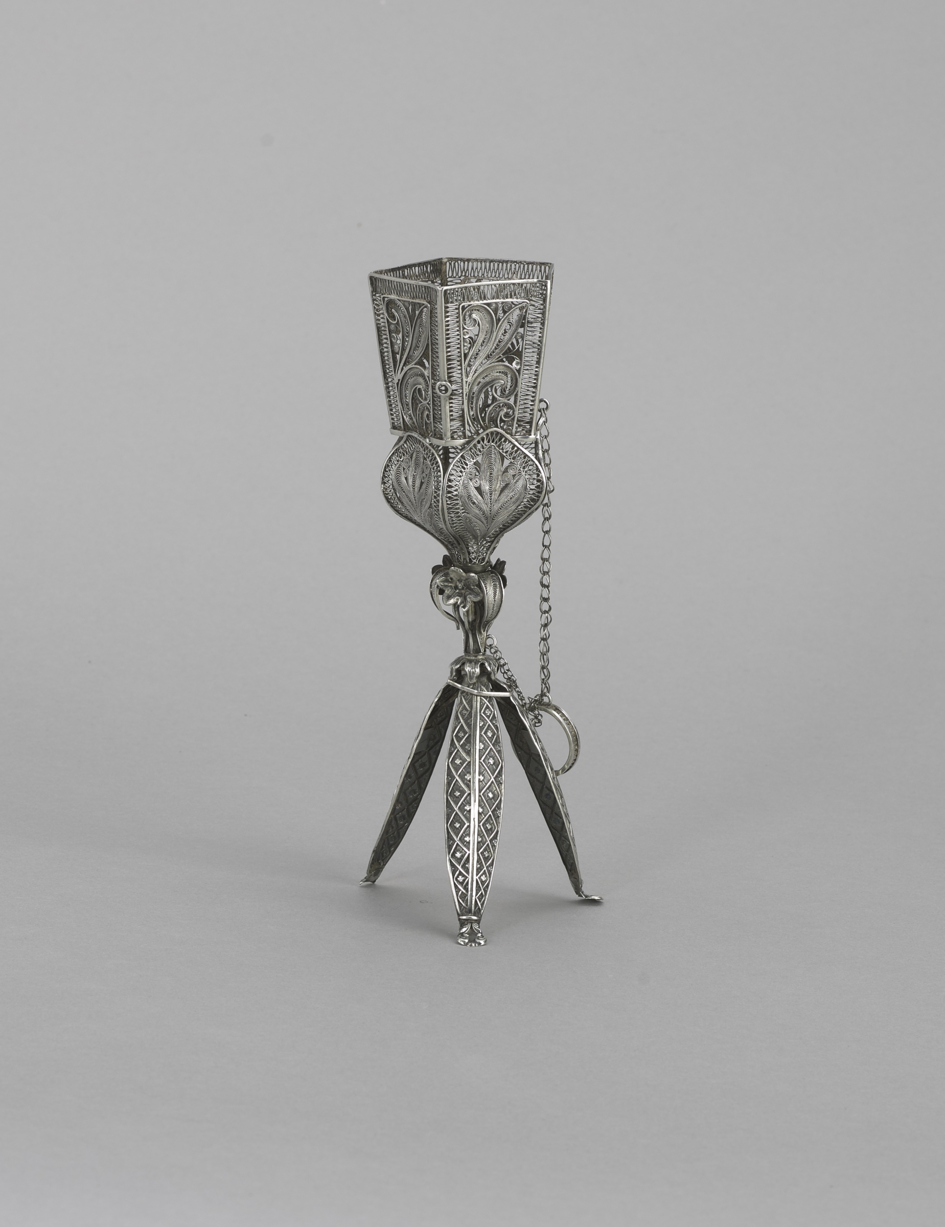 Silver filigree vase with tripod base