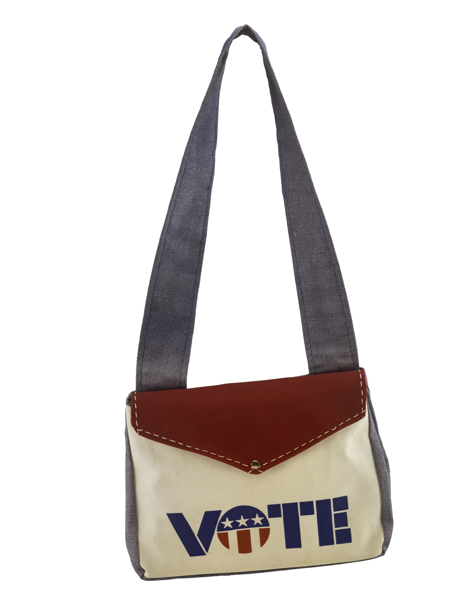Gray and tan bag with a red flap. It has a red and blue design that says "vote."