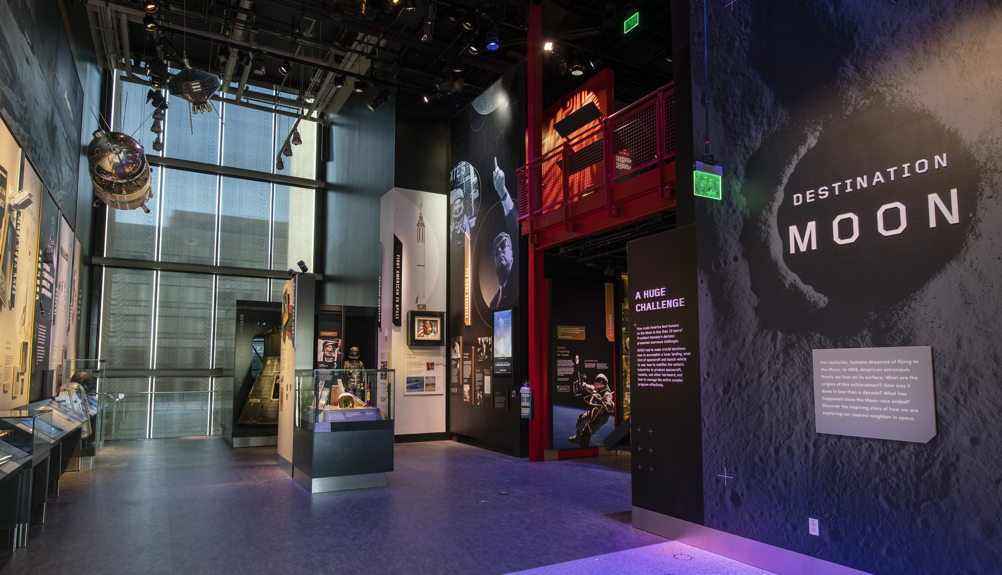 Entrance to Destination Moon exhibit with wall text and small artifacts