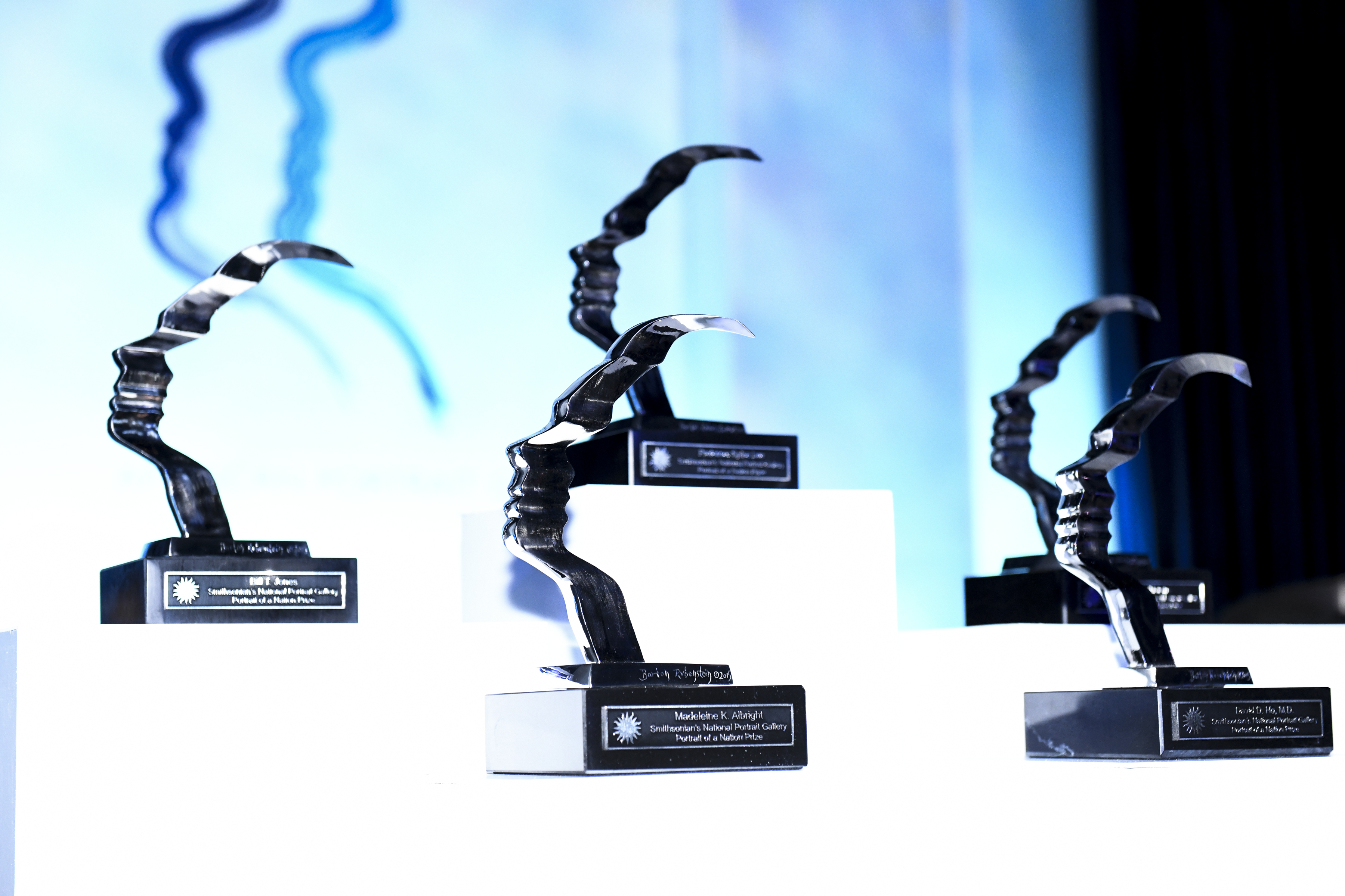Four awards perched on display stands