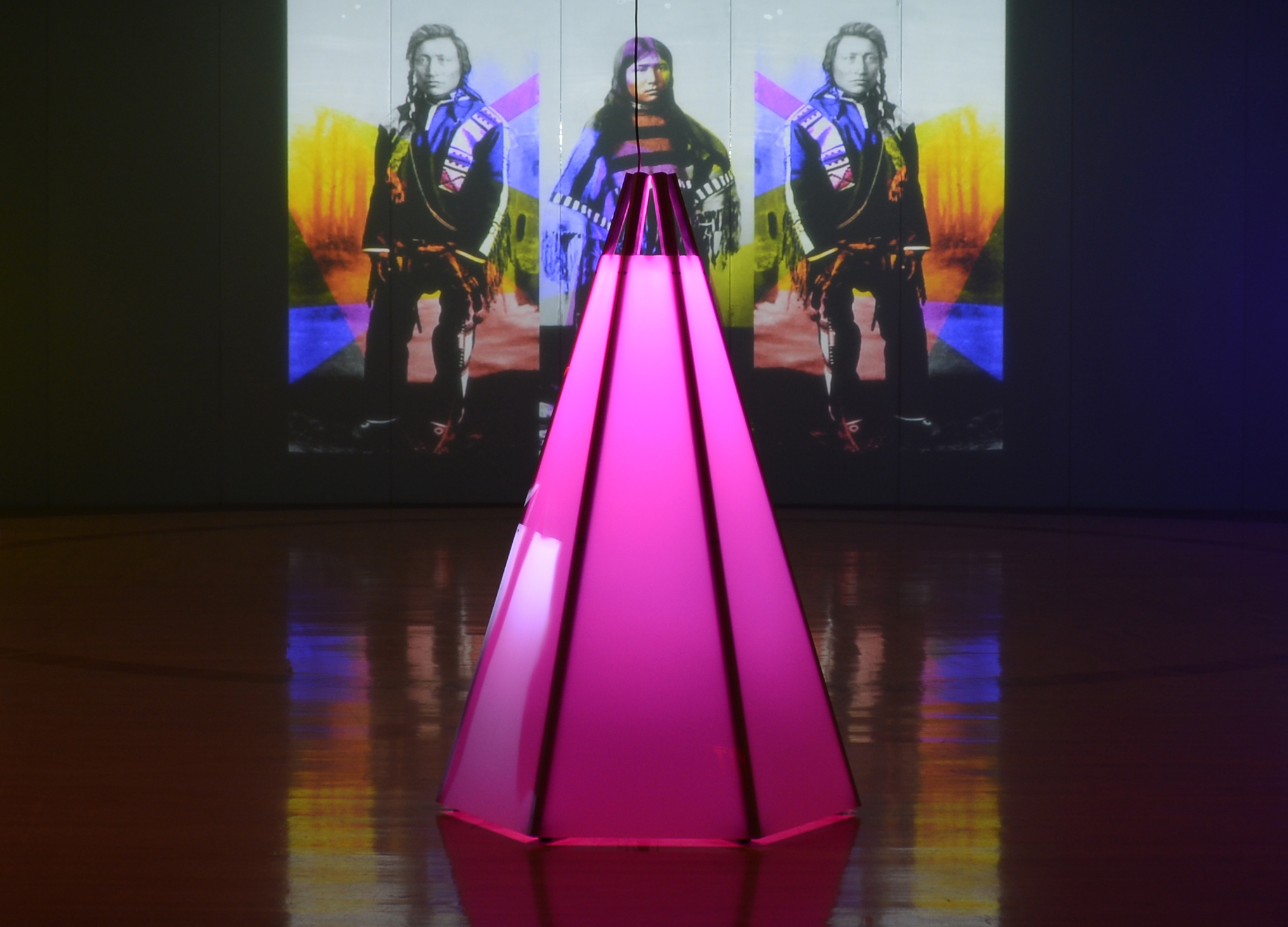 Art installation showing pink neon tipi