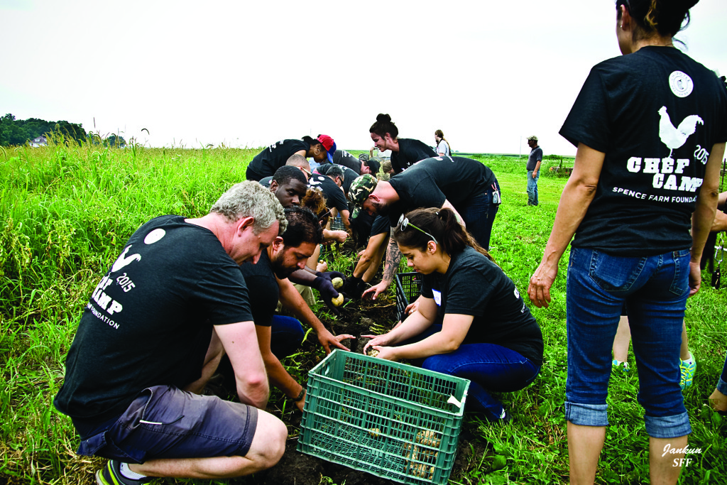 CHildren in Chef Camp T-shirts harvesting vegetables