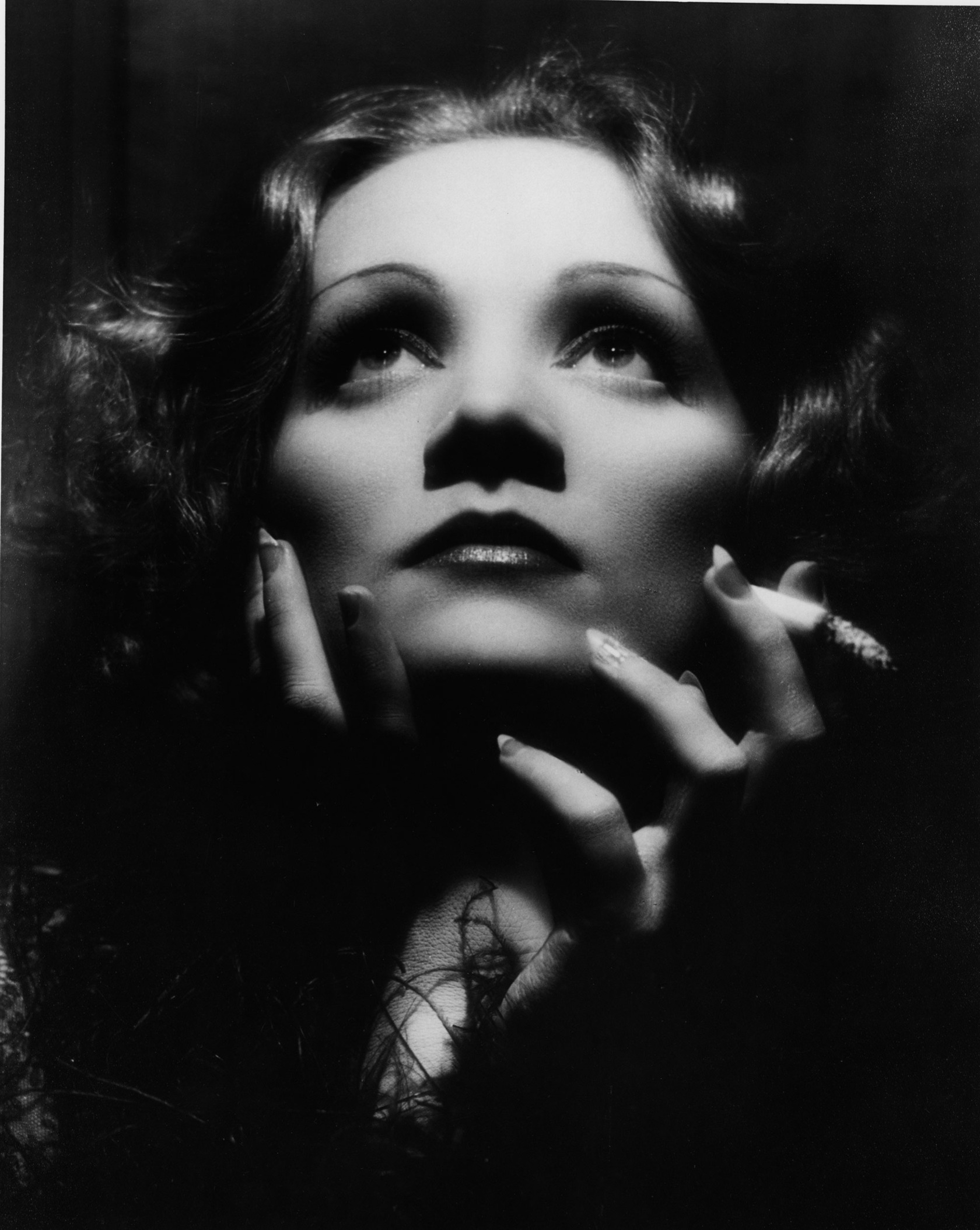 Black and white studio portrait of Marlene Dietrich as Shanghai Lily
