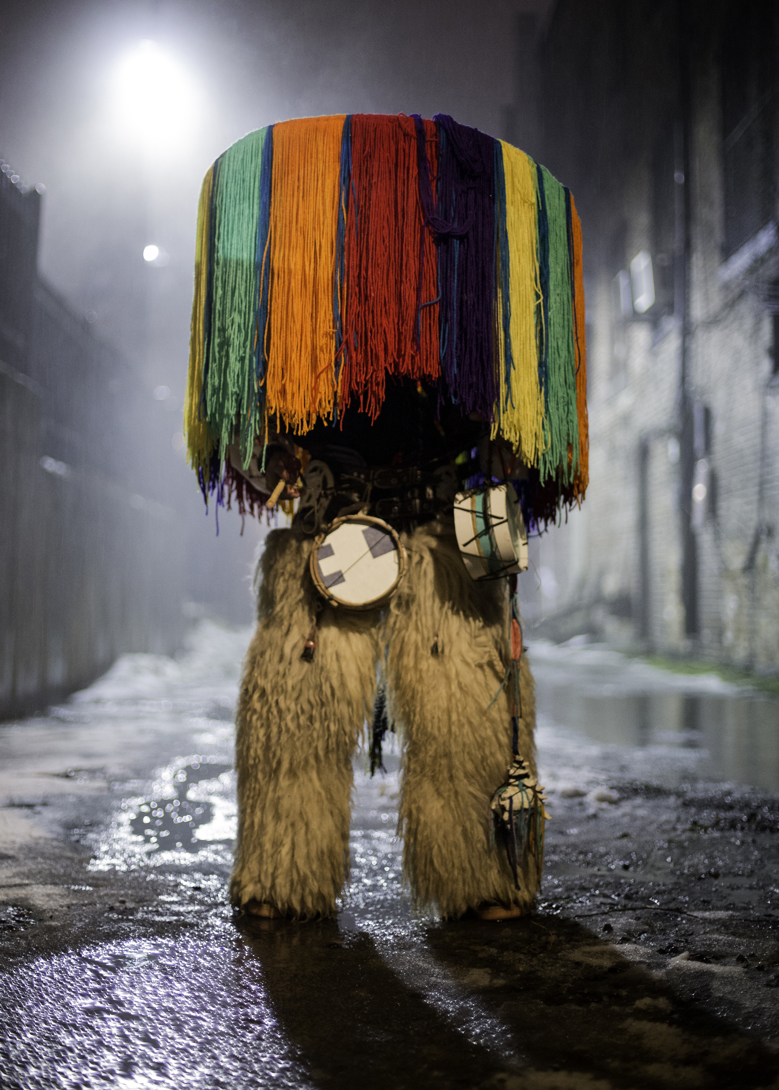 Person obscured by colorful Native costume