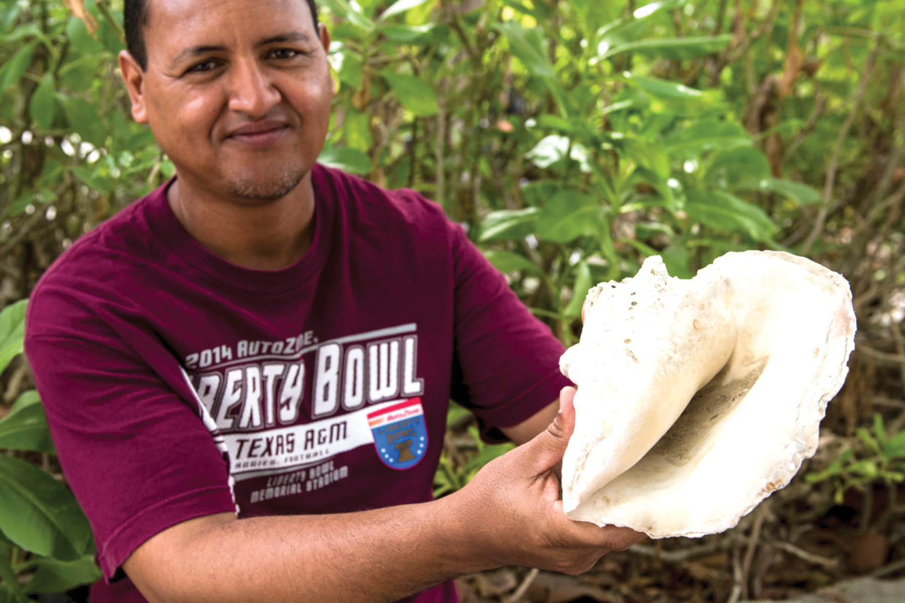 Man holding conch shell