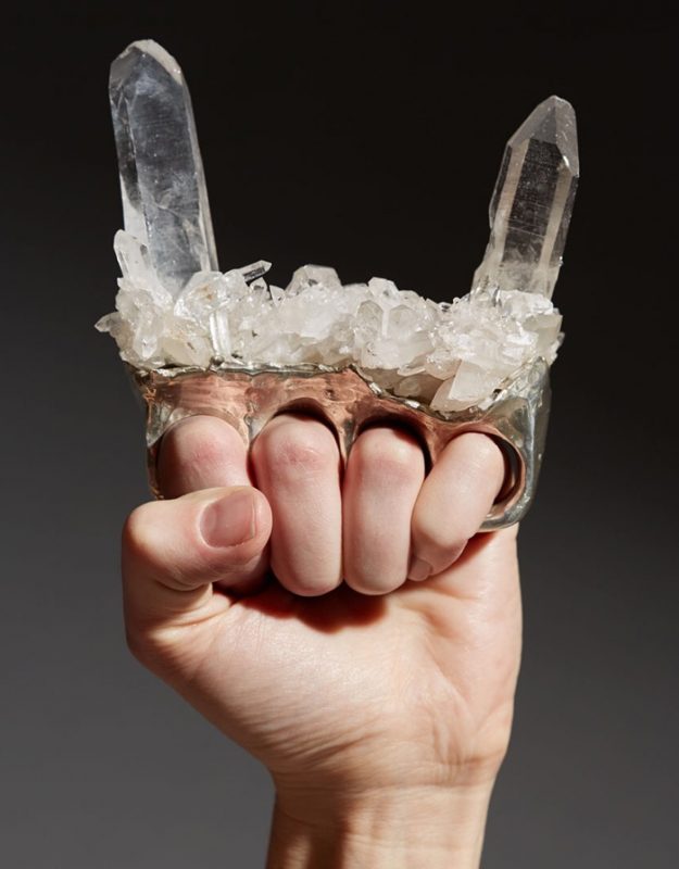 hand holding crystal devil horns