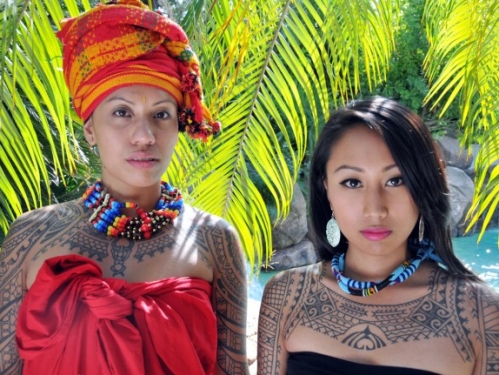Two women with tattoos.