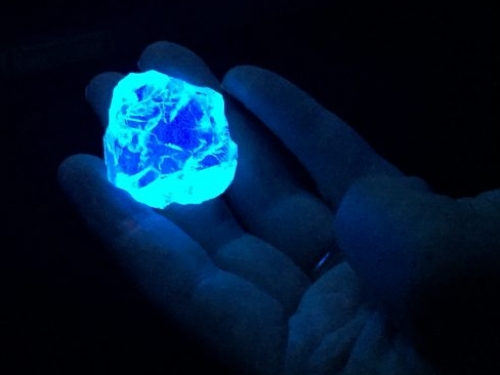 glowing diamond under UV light.