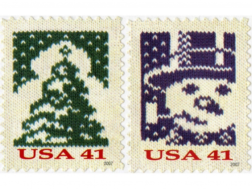 Three stamps with designs featuring a stag, tree and snowman