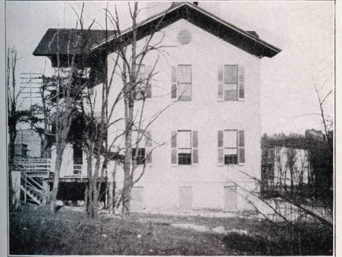 Archival photo of a two story house