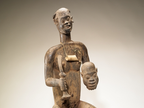 Figure of King Bay Akiy carved in wood.