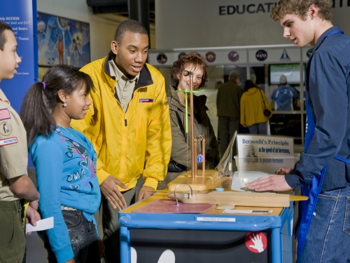 Young people at exhibit display