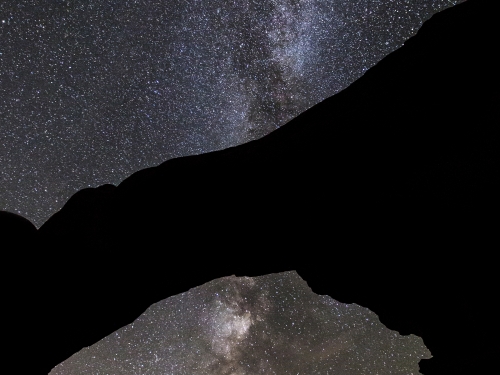 Starlit sky seen through natural arch