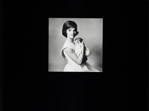 Black and White photo of Jacqueline Kennedy holding infant John