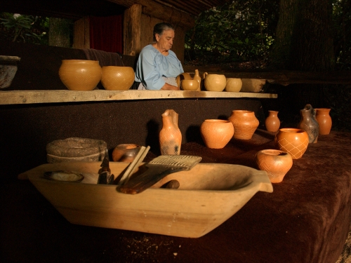 A potter with traditional Cherokee pottery