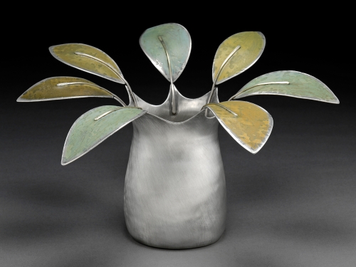 Metal vase with flowers