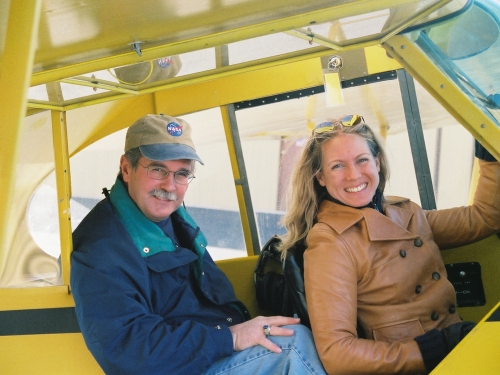 Father and daughter in cockpit of plane