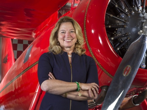 Stofan in front of a red plane.