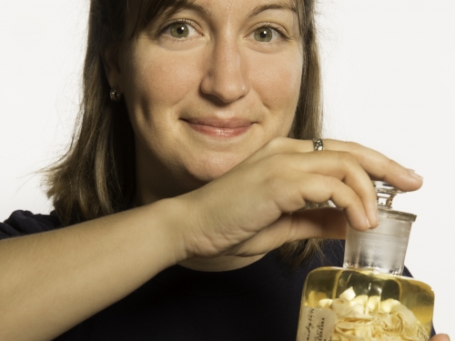 woman holding jar of parasites
