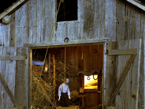 Model of man hanging in barn