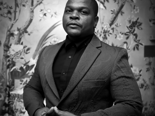 Black and white portrait of artist Kehinde Wiley