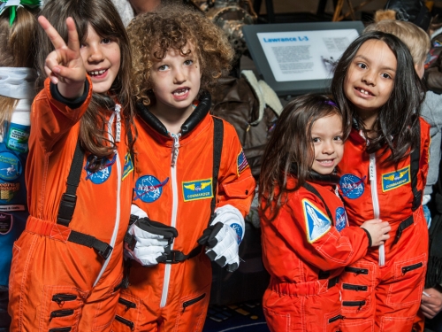 Young girls in astronaut uniforms
