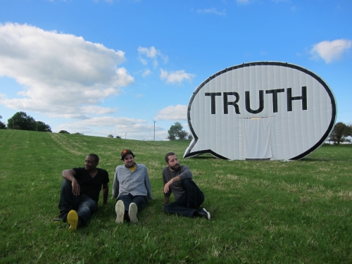 Truth Booth in a field of grass