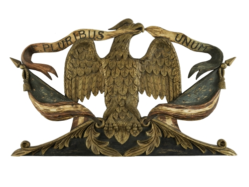 Wooden eagle holding e pluribus unum banner
