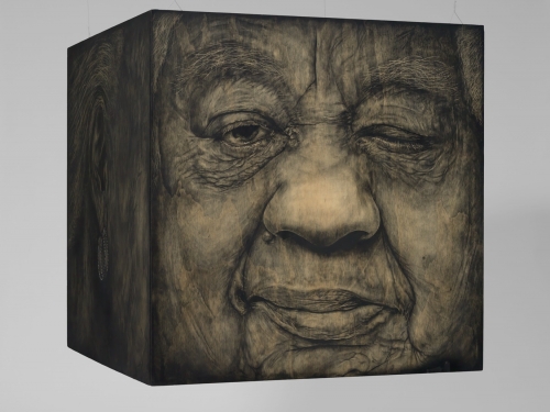 Cube showing woman's face