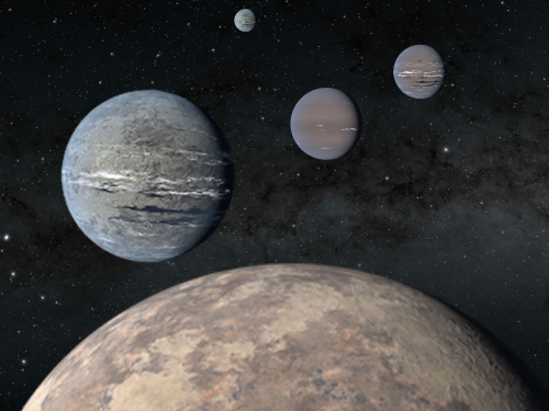 Artist rendering of 5 planets of varying sizes