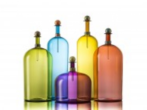 Colored glass bottles grouped together