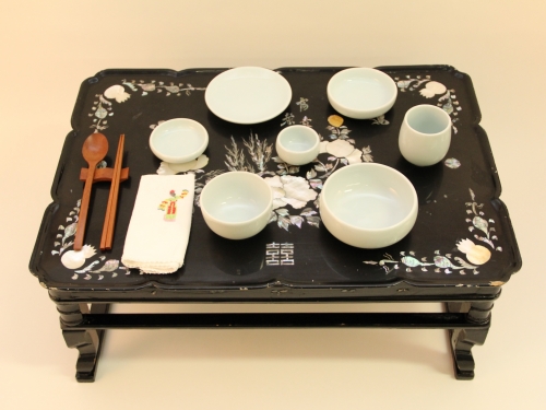 low tea table set with porcelain dishes