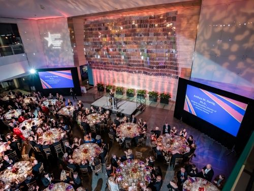Special event with round tables, lighting, and projectors in American History Museum