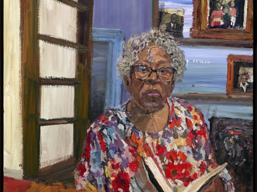 Painting of woman with short, white curly hair and glasses sitting in a dining room reading a book.