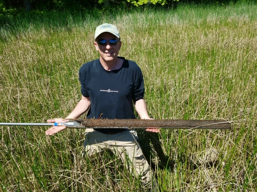 Scientist with soil core