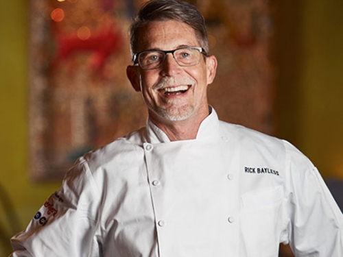 Promotional photo of Bayless in chef's whites