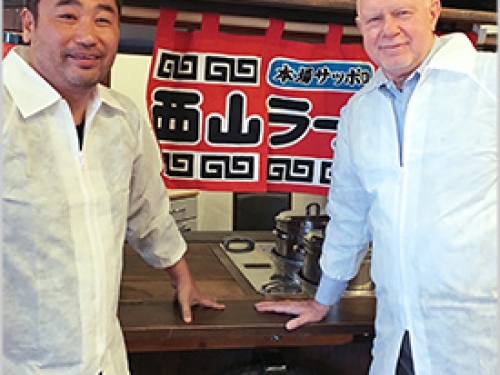 Daisuke Utagawa and Rudy Maxa at sushi bar
