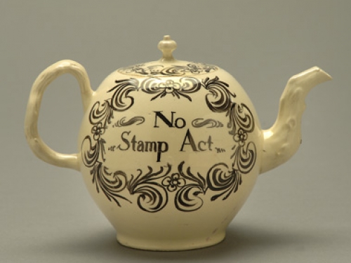ceramic teapot with No Stamp Act painted on it