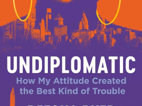 Purple and orange book cover with lower half of womans face above Washington DC skyline and large white text.